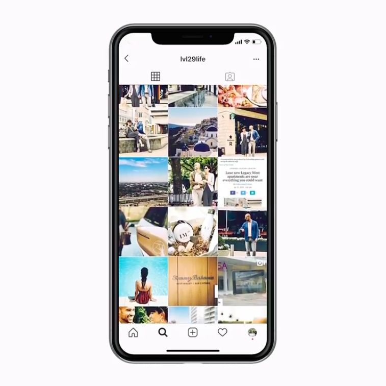 Smartphone showing the lvl29life Instagram profile grid of lifestyle and neighborhood photos
